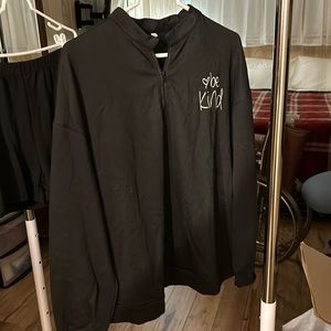 Black in color jersey be kind logo large size. Also selling shorts large.